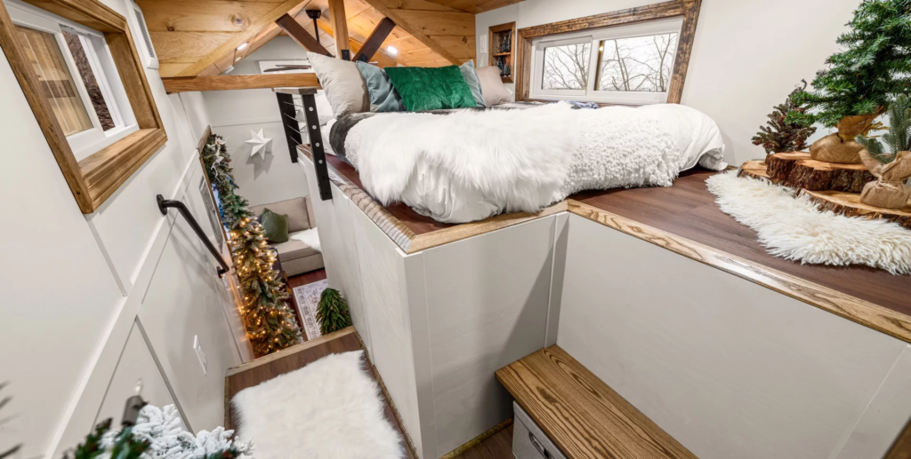 The Spruce's bedroom includes a double bed and some more storage space