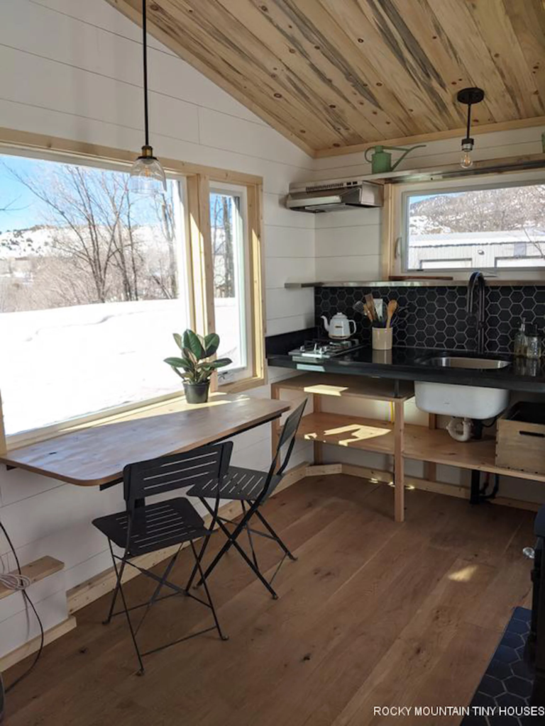 The Boulder 2.5 has a basic kitchenette with a fridge, sink, and two-burner propane-powered stove