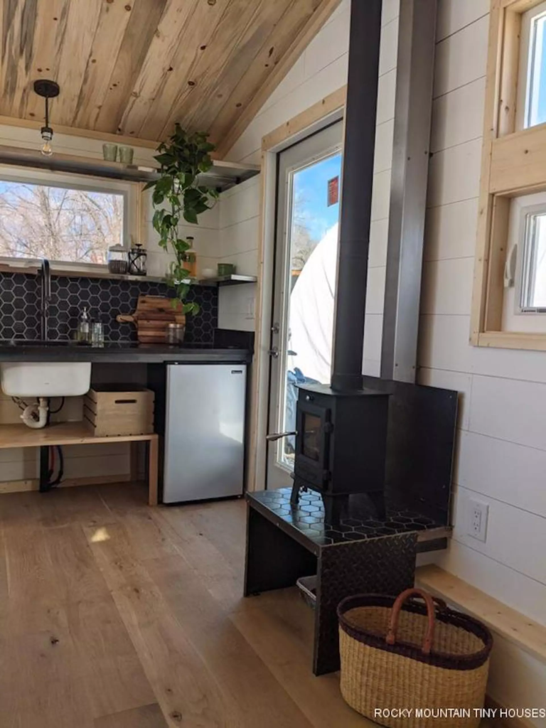The Boulder 2.5 is kept warm with a wood-burning stove and an electric heater