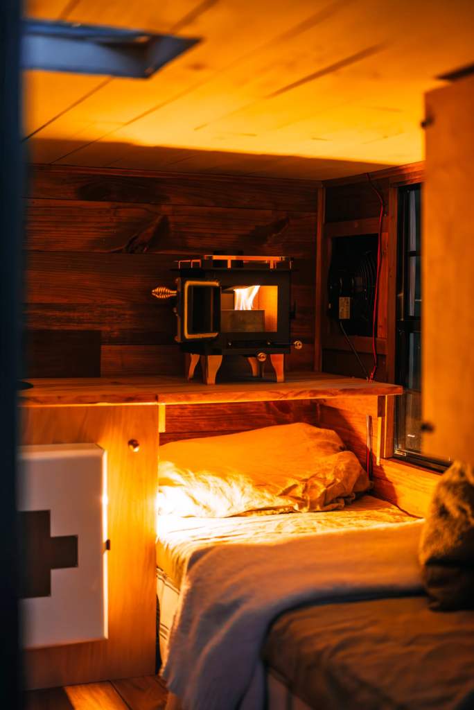 The micro-camper includes a basic kitchen and a small alcohol burning stove