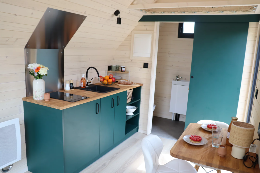The Nid's kitchen is compact and basic
