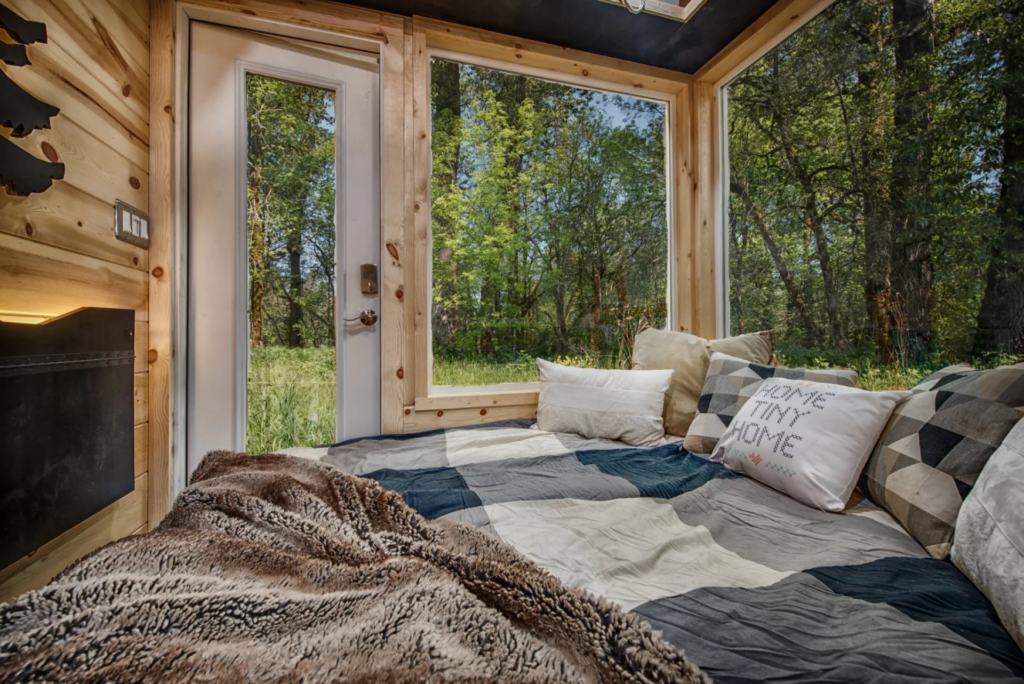 The Acorn's living space hosts a sofa bed and pulls triple-duty as a living room, bedroom, and a dining area